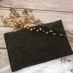 organic cotton Cherry stone pillow from Equilibrium lifestyle in black with white dots