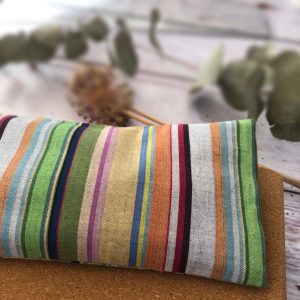 A multicoloured, handmade eye pillow made of organic materials from Equilibrium Lifestyle